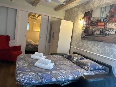 Un ou plusieurs lits dans un hébergement de l'établissement Ancien Atelier Parisien Grand 2 pièces