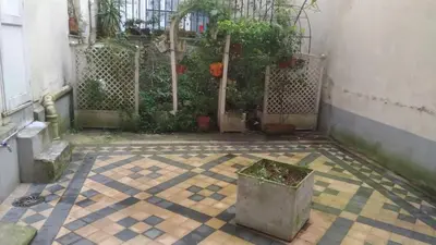 Jardin de l'établissement Appartement 2 pièces à Auteuil