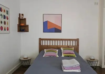 Un ou plusieurs lits dans un hébergement de l'établissement Cozy appart near Bastille