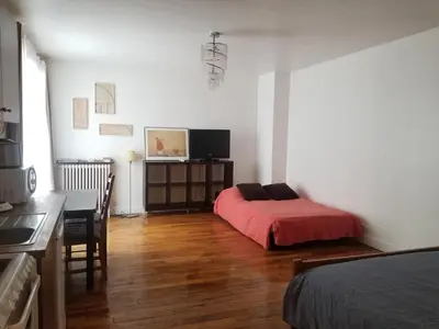 Un ou plusieurs lits dans un hébergement de l'établissement Cozy appart near Bastille