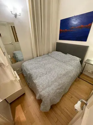Un ou plusieurs lits dans un hébergement de l'établissement Romantique Suite Pont Neuf