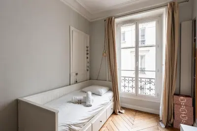 Un ou plusieurs lits dans un hébergement de l'établissement Appartement Palido - Welkeys