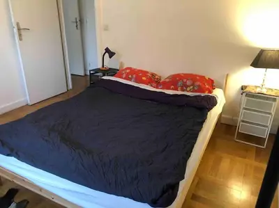 Un ou plusieurs lits dans un hébergement de l'établissement Grand appartement proche métro