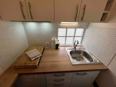 Cuisine ou kitchenette dans l'établissement Tour Eiffel - Studio vue imprenable au-dessus des toits, balcon