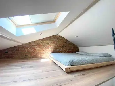 Un ou plusieurs lits dans un hébergement de l'établissement Appartement Chic au calme