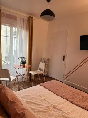 Un ou plusieurs lits dans un hébergement de l'établissement Studio indépendant près de Montmartre