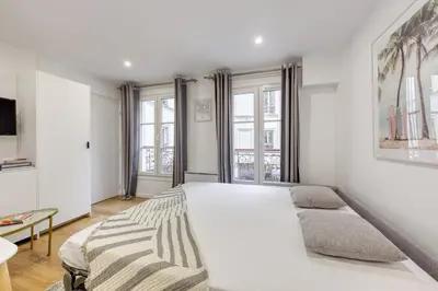Un ou plusieurs lits dans un hébergement de l'établissement Le Balcon de l'Opéra I Studio Cozy