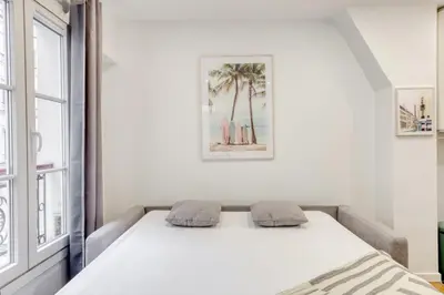 Un ou plusieurs lits dans un hébergement de l'établissement Le Balcon de l'Opéra I Studio Cozy