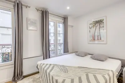 Un ou plusieurs lits dans un hébergement de l'établissement Le Balcon de l'Opéra I Studio Cozy
