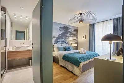 Un ou plusieurs lits dans un hébergement de l'établissement Apartment Notre Dame de Paris by Studio prestige