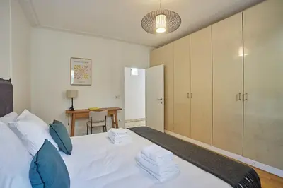Un ou plusieurs lits dans un hébergement de l'établissement Apartment Center of Paris Montmartre by Studio prestige
