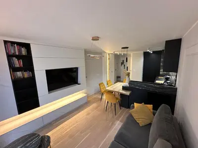Télévision ou salle de divertissement dans l'établissement Elegant Apartment Minutes from Paris