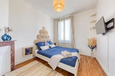 Un ou plusieurs lits dans un hébergement de l'établissement Appartement chic proche gare de Clamart + Netflix