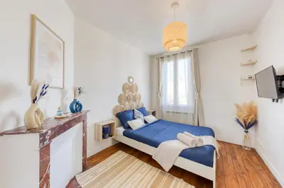 Un ou plusieurs lits dans un hébergement de l'établissement Appartement chic proche gare de Clamart + Netflix