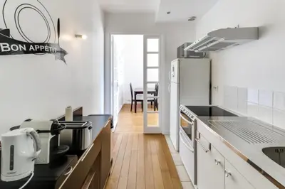 Cuisine ou kitchenette dans l'établissement Appartement Garros - Welkeys