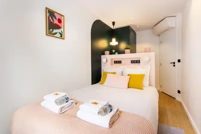 Un ou plusieurs lits dans un hébergement de l'établissement Magnificent apartment - 3BR-6P - Nation