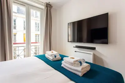 Un ou plusieurs lits dans un hébergement de l'établissement Magnificent apartment - 3BR-6P - Nation