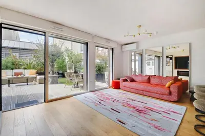 Coin salon dans l'établissement Giulia Prestige, appartement avec Terrasse Luxe & Confort aux Portes de Paris