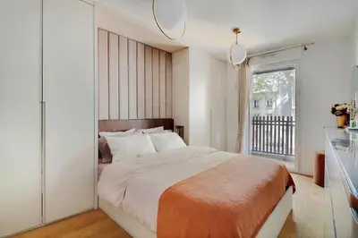 Un ou plusieurs lits dans un hébergement de l'établissement Giulia Prestige, appartement avec Terrasse Luxe & Confort aux Portes de Paris