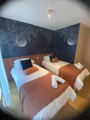 Un ou plusieurs lits dans un hébergement de l'établissement Giulia Prestige, appartement avec Terrasse Luxe & Confort aux Portes de Paris