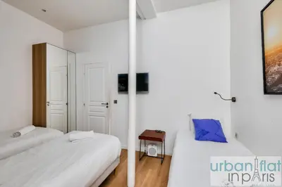 Un ou plusieurs lits dans un hébergement de l'établissement 62 - Beautiful Apartment Triangle d- 100m from Champs-Elysees