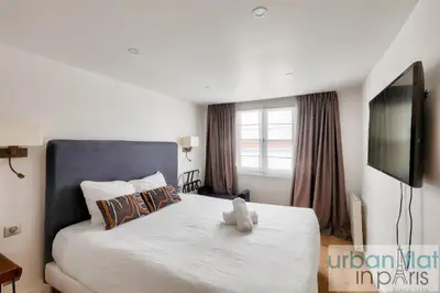 Un ou plusieurs lits dans un hébergement de l'établissement 62 - Beautiful Apartment Triangle d- 100m from Champs-Elysees