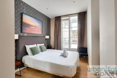 Un ou plusieurs lits dans un hébergement de l'établissement 62 - Beautiful Apartment Triangle d- 100m from Champs-Elysees