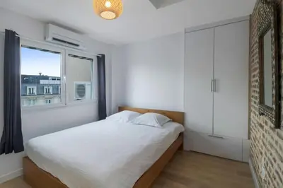 Un ou plusieurs lits dans un hébergement de l'établissement 1 Bedroom#Haussmann#Amazing view#EffeilTower#AC
