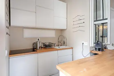 Cuisine ou kitchenette dans l'établissement Studio Loft des Combes - Welkeys