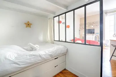 Un ou plusieurs lits dans un hébergement de l'établissement Studio Loft des Combes - Welkeys