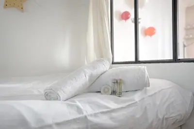 Un ou plusieurs lits dans un hébergement de l'établissement Studio Loft des Combes - Welkeys