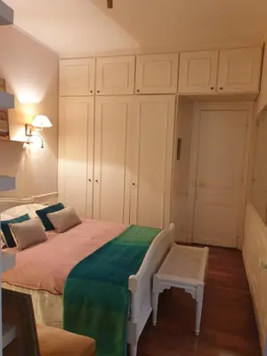 Un ou plusieurs lits dans un hébergement de l'établissement Appartement haussmannien cosy
