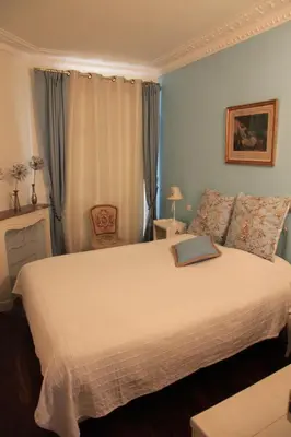 Un ou plusieurs lits dans un hébergement de l'établissement Apartment Lourmel