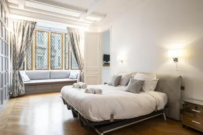 Un ou plusieurs lits dans un hébergement de l'établissement Deluxe Paris St Germain Suite