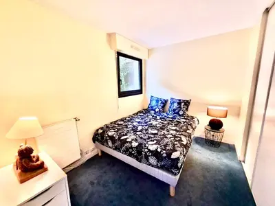Un ou plusieurs lits dans un hébergement de l'établissement Superbe appartement terrasse