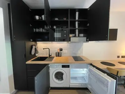 Cuisine ou kitchenette dans l'établissement Studio rénové avec balcon près des Champs-Elysées
