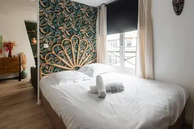 Un ou plusieurs lits dans un hébergement de l'établissement Appartement Feydeau - Welkeys