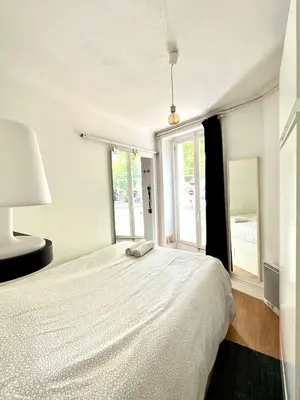 Un ou plusieurs lits dans un hébergement de l'établissement Best flat in Paris