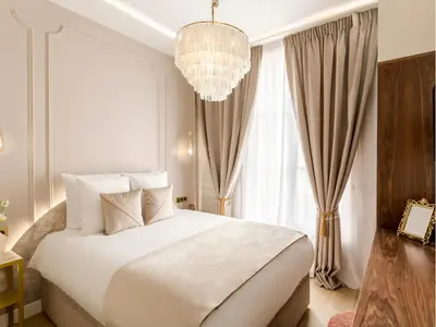 Un ou plusieurs lits dans un hébergement de l'établissement Merveil - Signature Suite - Champs Elysees -Kleber
