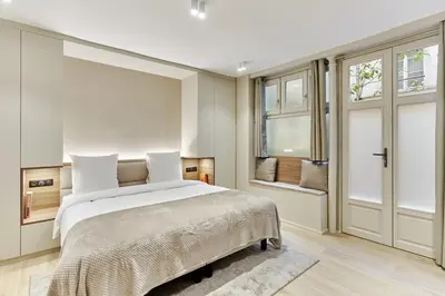 Un ou plusieurs lits dans un hébergement de l'établissement Studio Center of Paris by Studio prestige