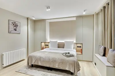 Un ou plusieurs lits dans un hébergement de l'établissement Studio Center of Paris by Studio prestige