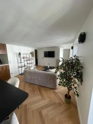 Télévision ou salle de divertissement dans l'établissement Appartement Neuf à 500m des Champs-Élysées