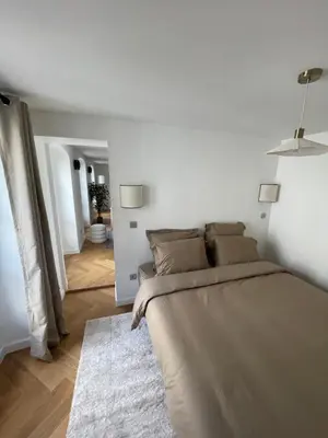 Coin salon dans l'établissement Appartement Neuf à 500m des Champs-Élysées