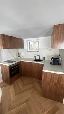 Cuisine ou kitchenette dans l'établissement Appartement Neuf à 500m des Champs-Élysées