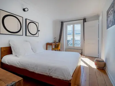 Un ou plusieurs lits dans un hébergement de l'établissement Paris Center - Haussmann Elegant Residence