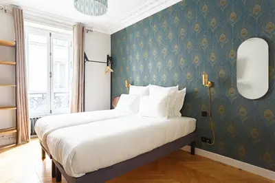 Un ou plusieurs lits dans un hébergement de l'établissement Stylish apartment in the heart of Paris