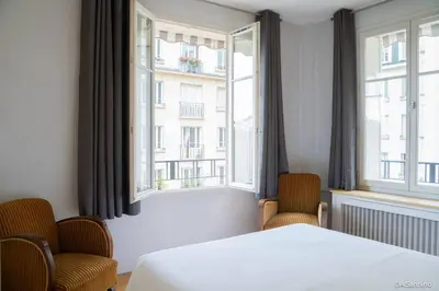 Un ou plusieurs lits dans un hébergement de l'établissement Moderne 2 pièces en plein Paris au bord de Seine