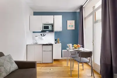 Cuisine ou kitchenette dans l'établissement Guestrust - Arc de Triomphe 46