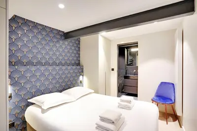 Un ou plusieurs lits dans un hébergement de l'établissement Bright & cosy apartment Palais Royal
