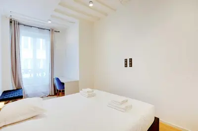 Un ou plusieurs lits dans un hébergement de l'établissement Bright & cosy apartment Palais Royal